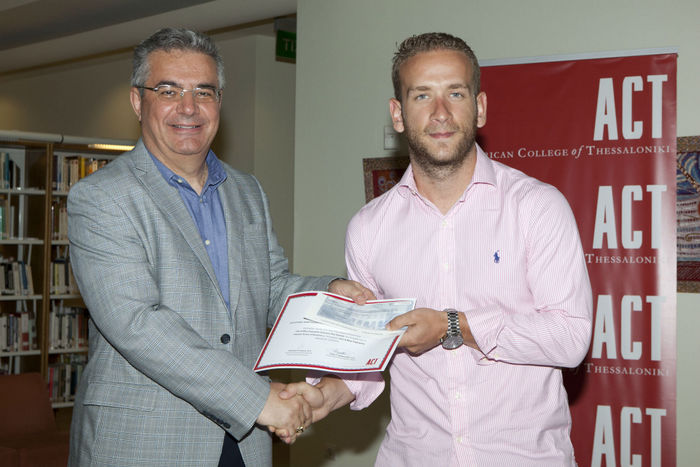 From left: Dr. Stamos Karamouzis, Vice President of Academic Affairs of ACT, awards Angelos Dragkolas for his idea on the recording, digitization and management of water networks and sewerage.