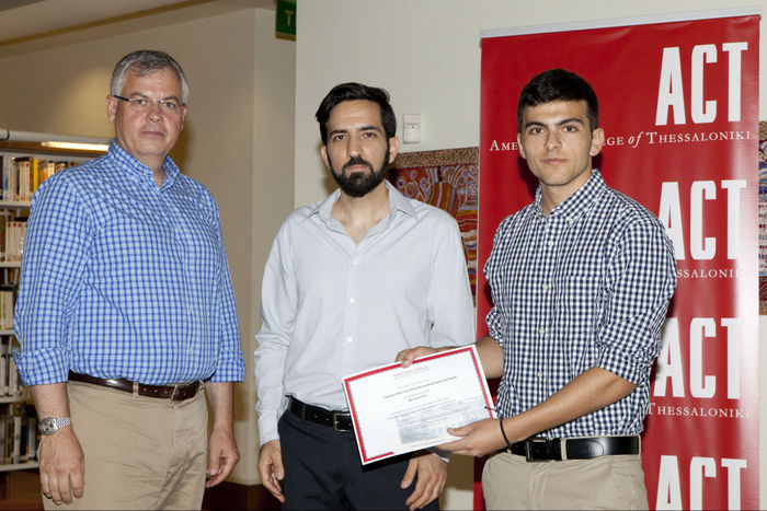 Peter Chrysanthakis, Vice President of Institutional Advancement of Anatolia College, with Stathis Karanastasis and Sotiris Papasotiriou winners of the Best Back Seat